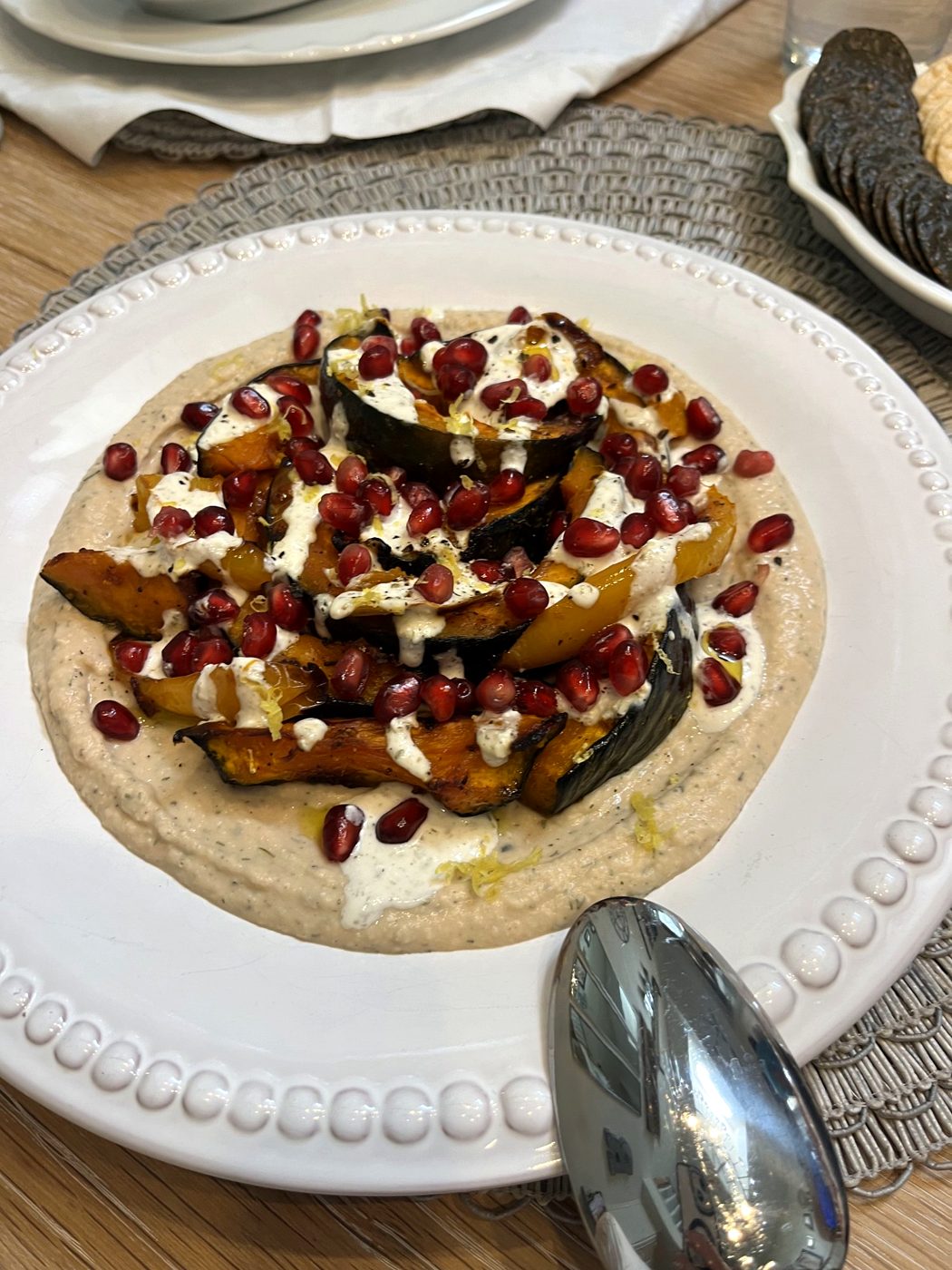 Roasted squash with pomegranate on a creamy purée