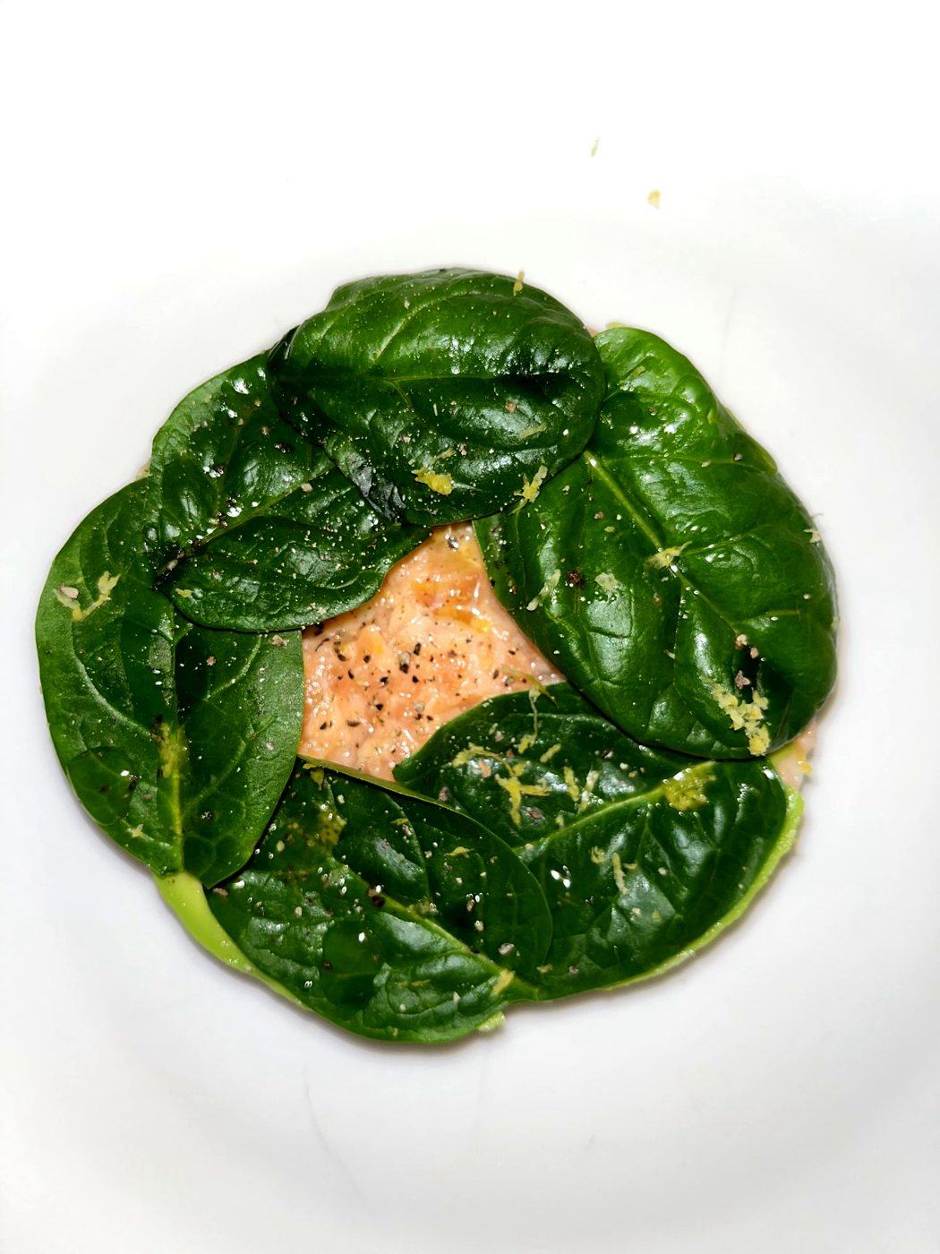 Salmon wrapped in fresh spinach leaves