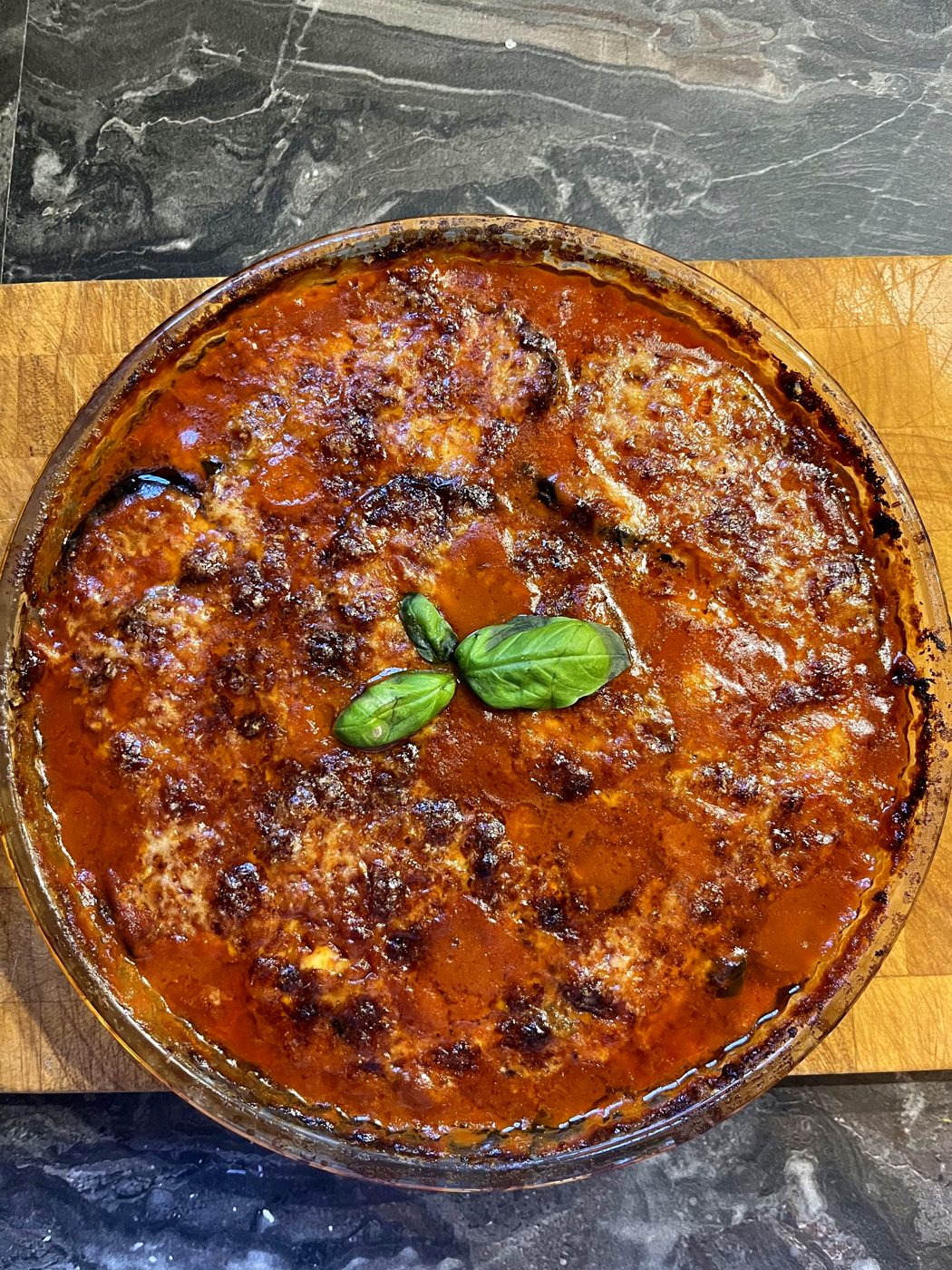 Baked aubergine parmigiana with basil