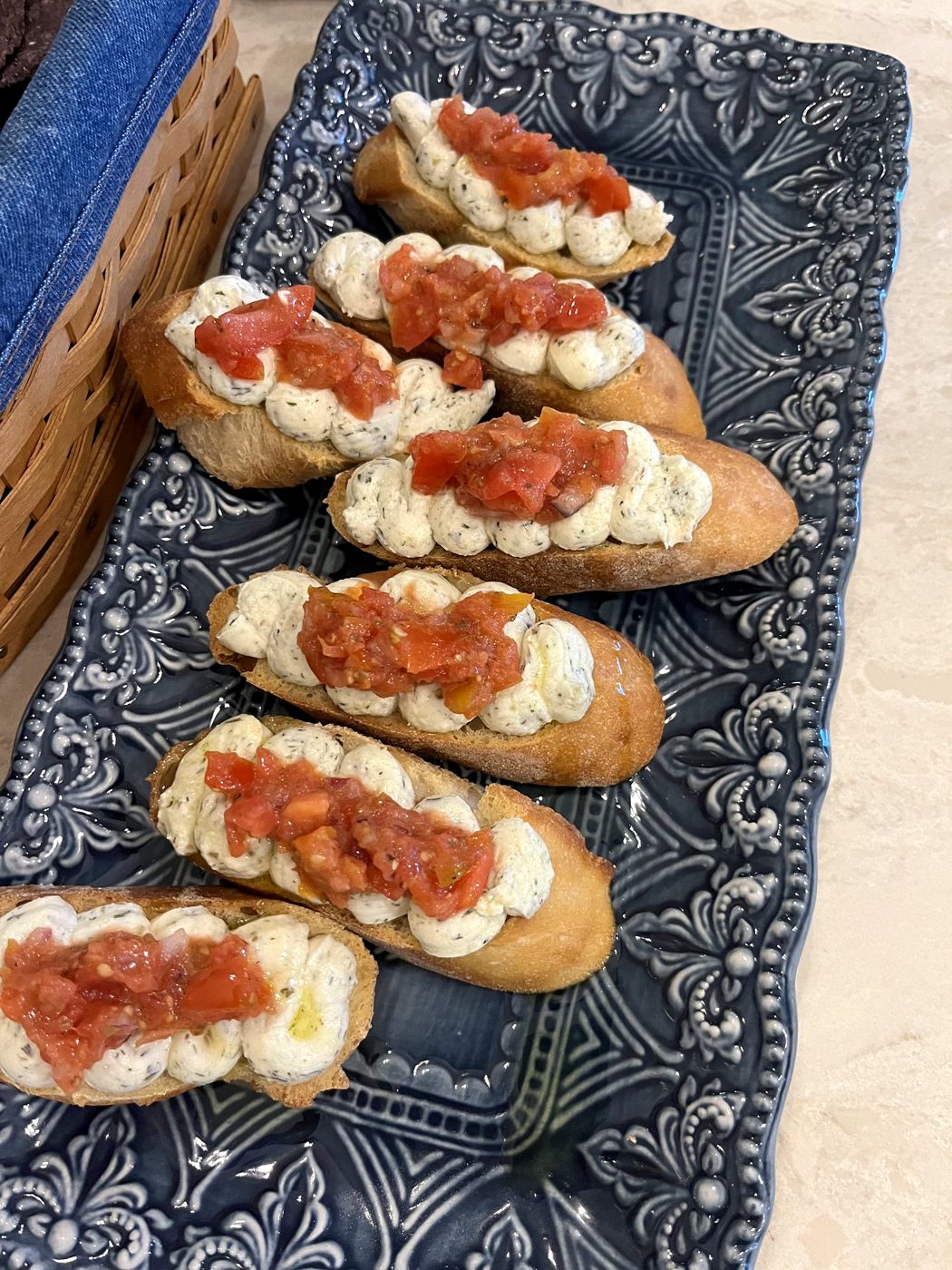 Crostini with whipped cheese and tomato