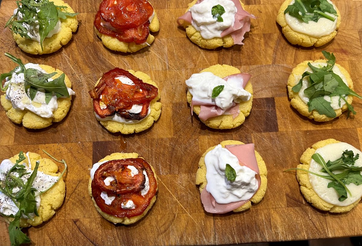 Savoury tartlets on a wooden board