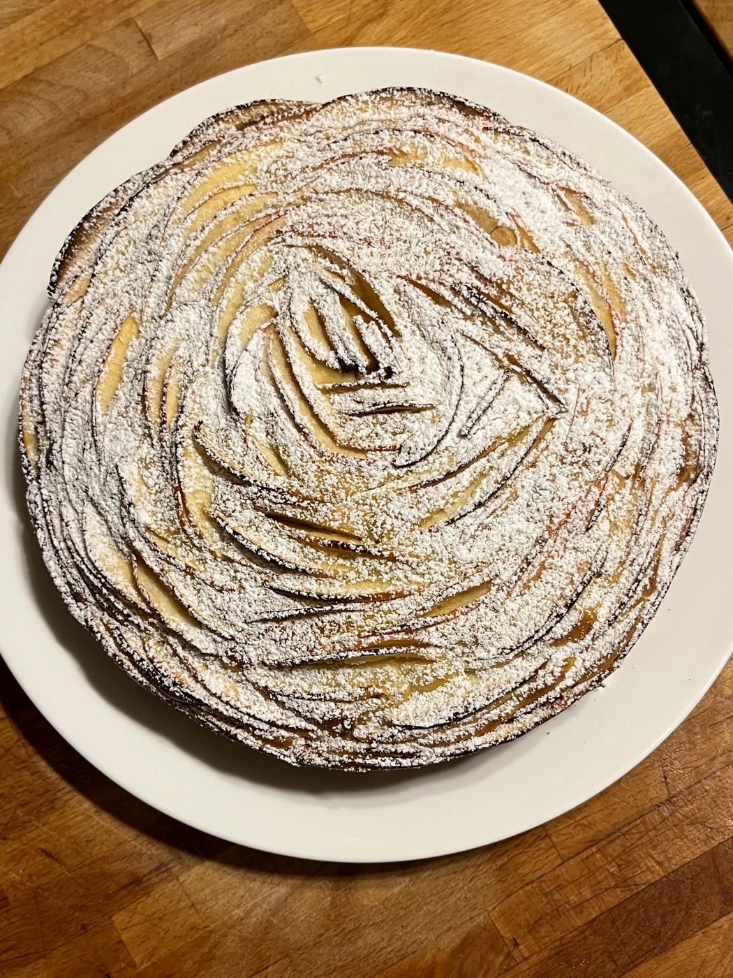 A pastry tart dusted with sugar