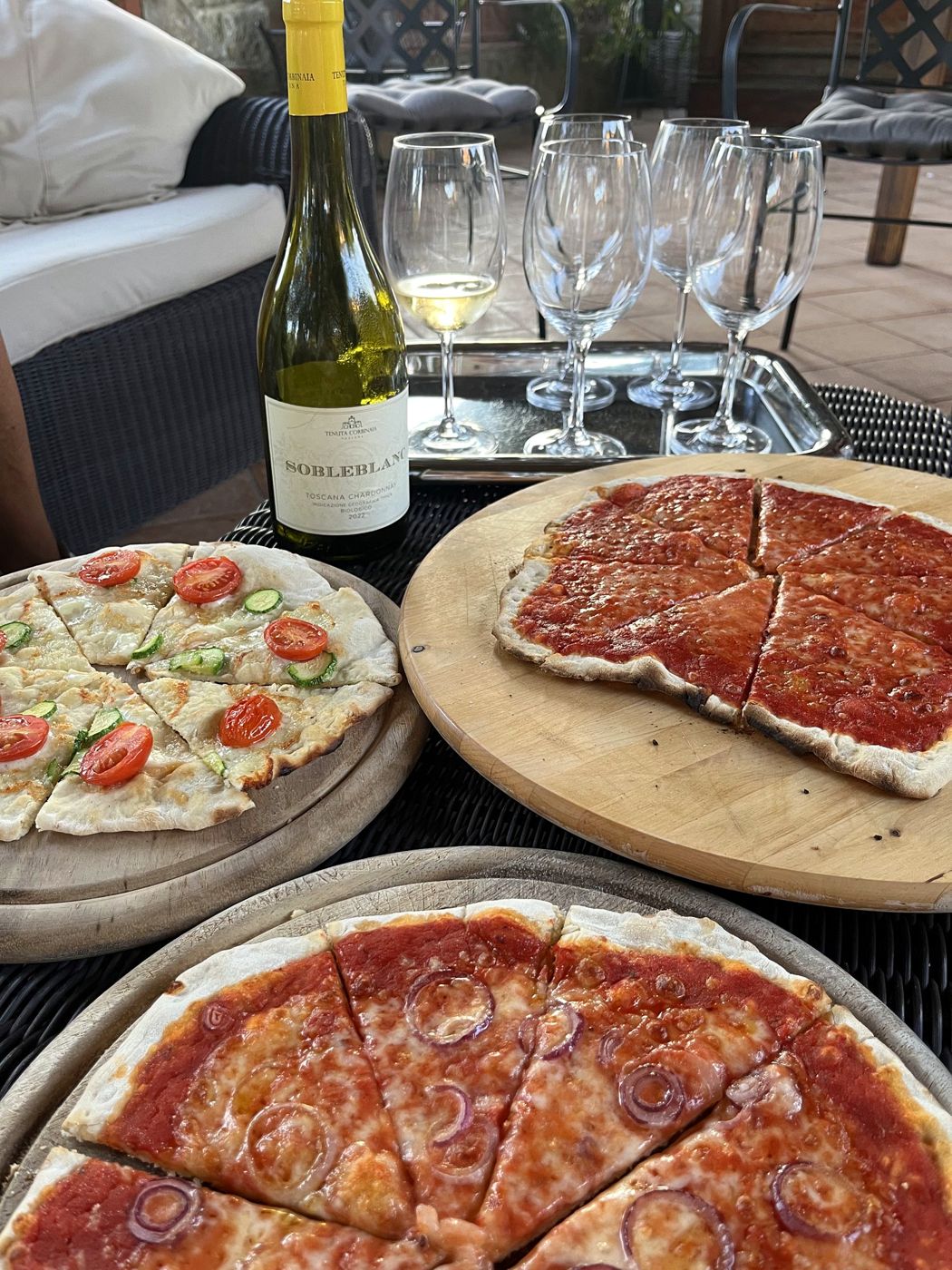 Pizzas and a bottle of wine on the terrace
